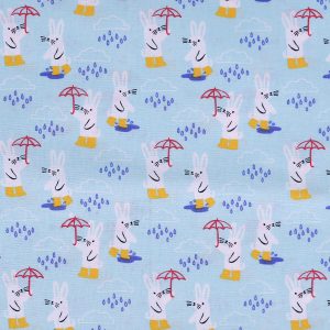 Bunnies In The Rain on Blue Novelty Cotton Fabric