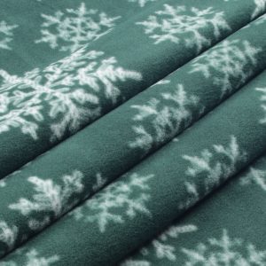 White Snowflakes on Green Anti Pill Fleece Fabric